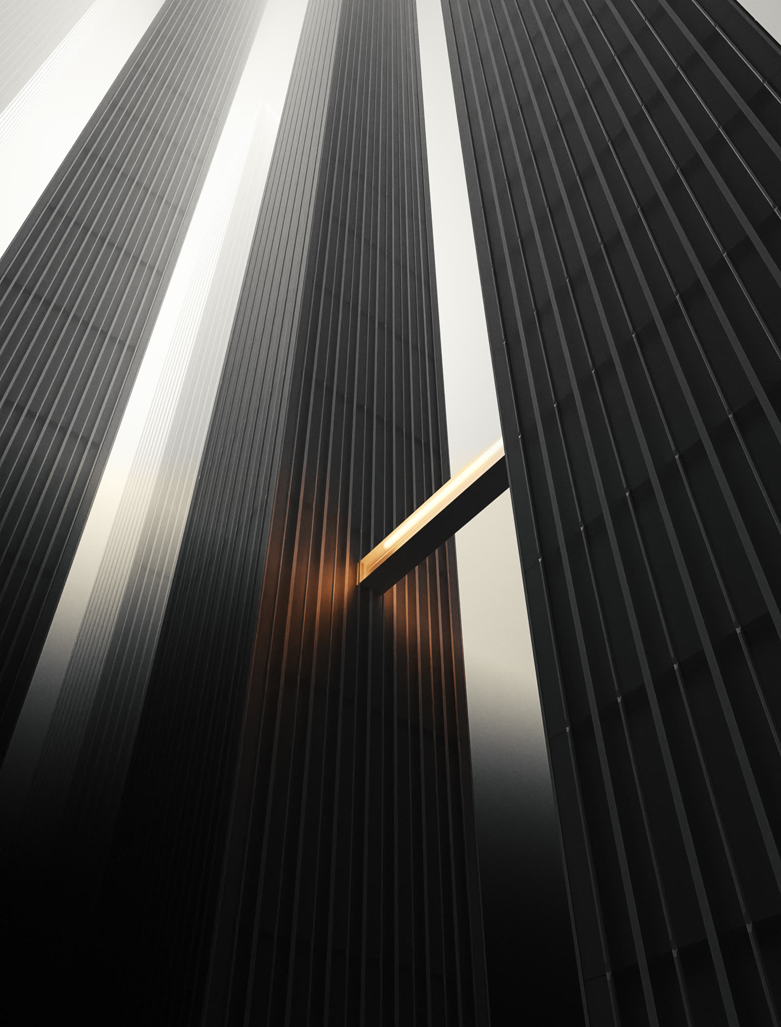 Looking up at dark towers split by a sharp diagonal beam of light