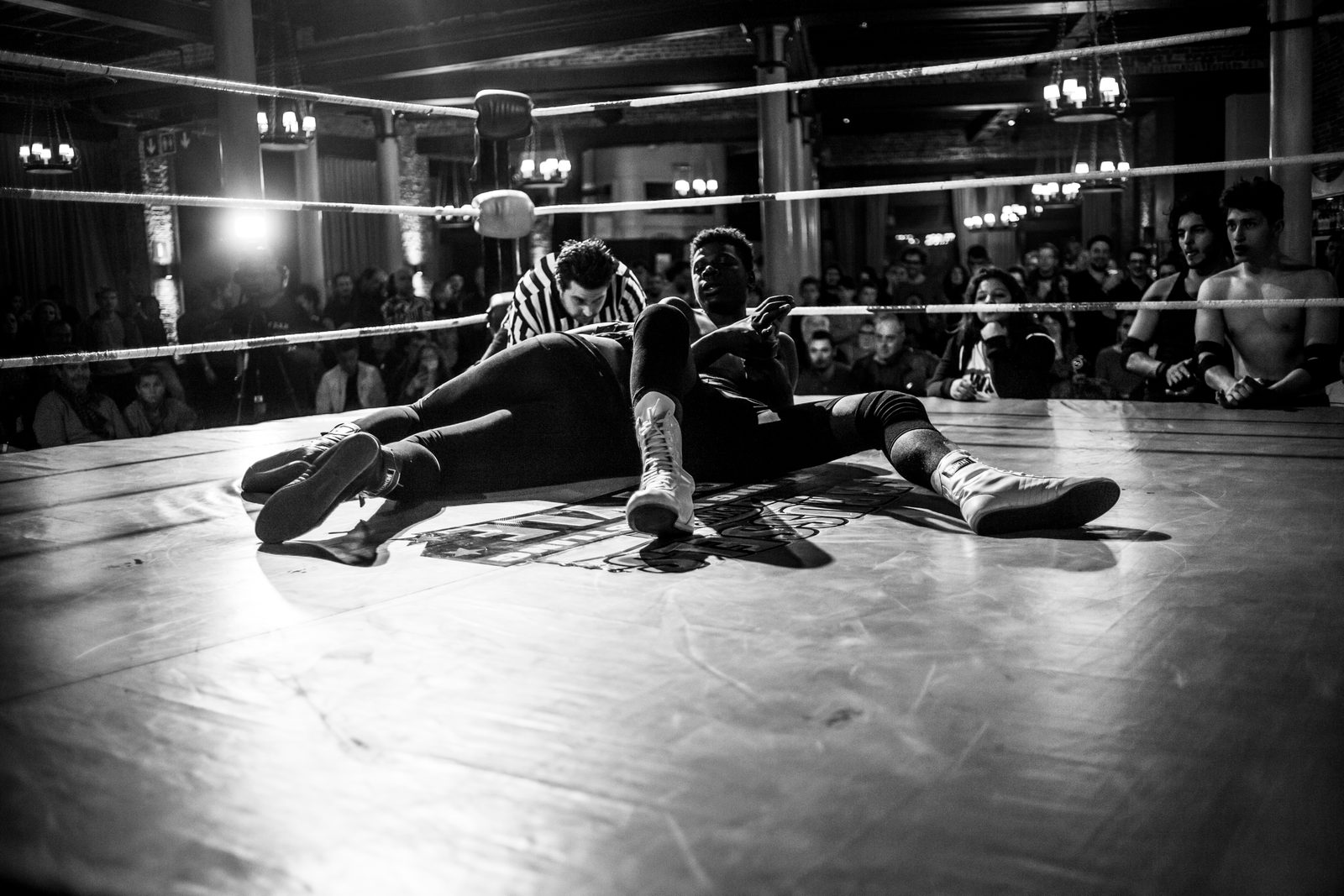 Two wrestlers locked in a hold, captured from ringside, Brussels 2015