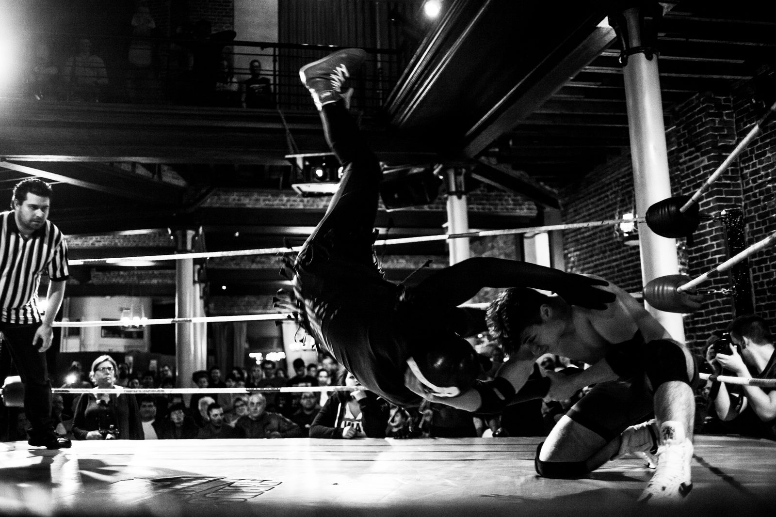 Wrestling action shot in dramatic arena lighting, Brussels 2015