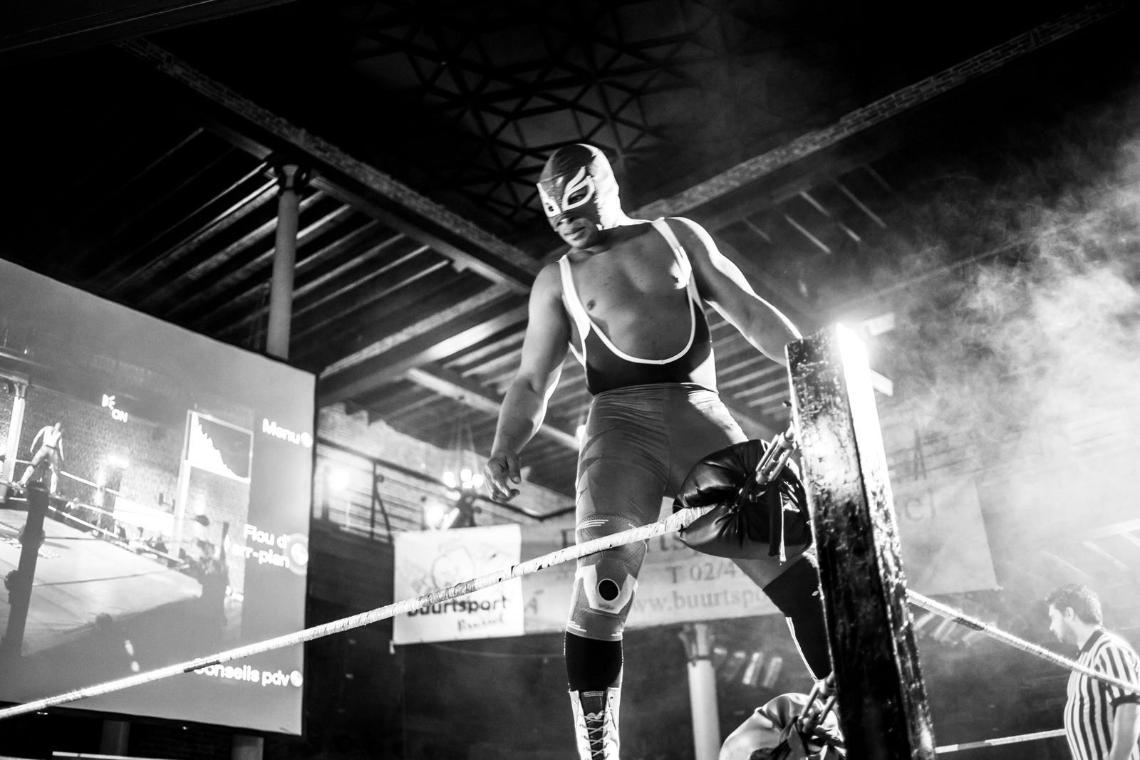 Apron-level view of wrestling match, raw energy and motion, Brussels 2015